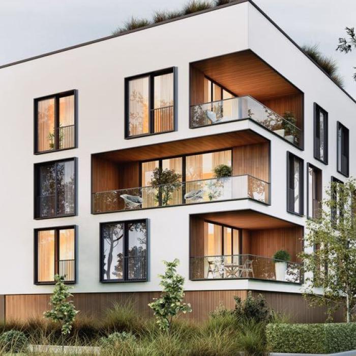 Ein großes Haus mit vielen Fenstern von Fensterbau Hartmann.